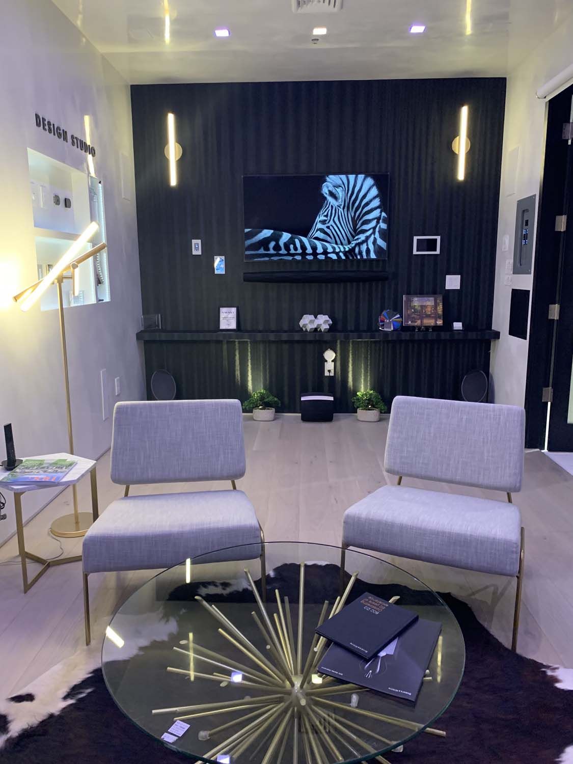 purple toned room with tv and soundbar on wall